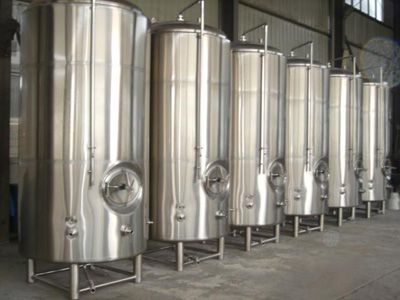 Vertical serving bright beer tanks isolated
